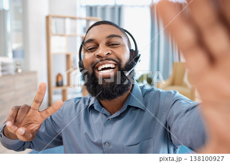Call center, selfie and portrait of customer service consultant in the office with peace sign. Happy, smile and African male telemarketing agent taking a picture with headset in the modern workplace. 138100927