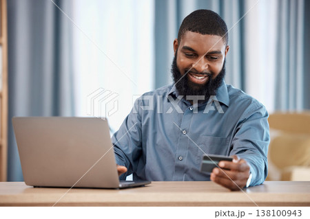 Business man, credit card and laptop for office online shopping, e commerce payment and happy loan. African employee on computer for web banking, financial investment or registration for debit order Business man, credit card and laptop for office online shopping, e commerce payment and happy loan. African employee on computer for web banking, financial investment or registration for debit order 138100943
