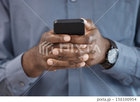 Phone, hands and closeup of businessman typing a message on the internet or mobile app. Technology, networking and African male person scroll on social media or website with cellphone in the office. Phone, hands and closeup of businessman typing a message on the internet or mobile app. Technology, networking and African male person scroll on social media or website with cellphone in the office. 138100954