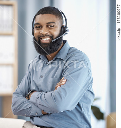 Man, call center and arms crossed in office, portrait or confident, pride or telemarketing job with smile. African CRM, consultant or customer support agent with microphone, headphones or networking 138100977