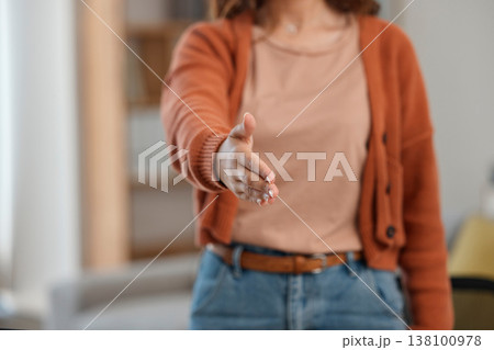 Creative woman, handshake and meeting for introduction, welcome or startup partnership at home. Closeup of female person shaking hands for greeting, b2b or deal in agreement, teamwork or thank you 138100978