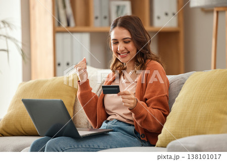 Excited, woman and laptop with credit card, banking and online shopping with fintech, transaction and happiness in a lounge. Person, home and girl on a couch, pc and celebration with payment or bonus Excited, woman and laptop with credit card, banking and online shopping with fintech, transaction and happiness in a lounge. Person, home and girl on a couch, pc and celebration with payment or bonus 138101017