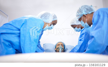 Patient, hospital and surgeon team with bed for emergency, healthcare or medical procedure. Doctors with a man to start collaboration, healing or surgery and operation with support and scrubs in ICU Patient, hospital and surgeon team with bed for emergency, healthcare or medical procedure. Doctors with a man to start collaboration, healing or surgery and operation with support and scrubs in ICU 138101129