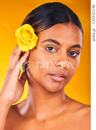 Skincare, flower and portrait of woman in studio with beauty, glow and cosmetic face routine. Makeup, rose and young female model from Mexico with facial treatment isolated by yellow background. Skincare, flower and portrait of woman in studio with beauty, glow and cosmetic face routine. Makeup, rose and young female model from Mexico with facial treatment isolated by yellow background. 138101146