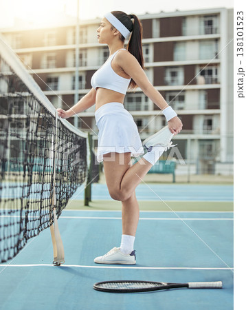 Woman, court and stretching before tennis game for fitness, exercise and workout outdoor in Cape Town. Flexibility, young person and leg training for sport competition, challenge and wellness or fit 138101523