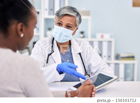 Senior woman, doctor and tablet for consultation, checkup or diagnosis with mask and patient at hospital. Mature female person, medical nurse or surgeon consulting customer with technology at clinic Senior woman, doctor and tablet for consultation, checkup or diagnosis with mask and patient at hospital. Mature female person, medical nurse or surgeon consulting customer with technology at clinic 138101712