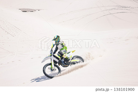 Man, driving and motorbike on sand for sport, adventure or competition outdoor in summer and mockup space. Motorcycle, ride and athlete on dirt, dune or desert for race, danger and fearless challenge Man, driving and motorbike on sand for sport, adventure or competition outdoor in summer and mockup space. Motorcycle, ride and athlete on dirt, dune or desert for race, danger and fearless challenge 138101900