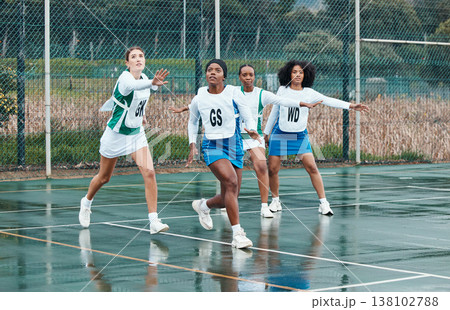 Sports, netball team and portrait of women training in competition, game or match. Fitness, group and girls workout on court, exercise and practice performance on wet field outdoor for healthy body 138102788