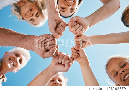 Happy big family, hands and fist bump in teamwork, motivation or unity for support or trust on sky background. Low angle of people smile touching in team collaboration, community or outdoor goals 138102879