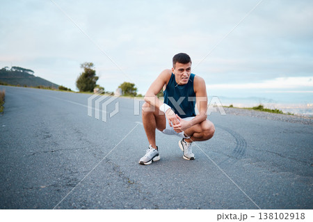Sports, nature and man athlete breathing on break of race, marathon or competition training and workout. Fitness, fatigue and tired young male runner resting for outdoor cardio exercise for endurance 138102918