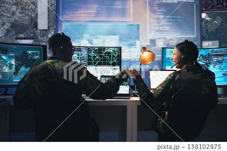 Control room, military and fist bump by soldier team on surveillance together at night for communication. Technology, global and teamwork by security with success on satellite map in army office 138102975