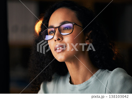 Business woman, glasses and reading on computer for programming, software or information technology solution. Young night programmer in screen reflection for IT problem solving, results or web coding 138103042