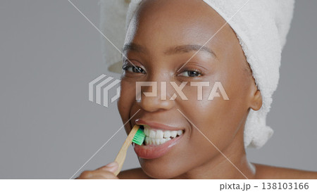 Portrait, black woman with toothbrush for teeth whitening and dental, health and wellness isolated on grey background. Oral hygiene, orthodontics and clean plaque away with morning routine in studio Portrait, black woman with toothbrush for teeth whitening and dental, health and wellness isolated on grey background. Oral hygiene, orthodontics and clean plaque away with morning routine in studio 138103166