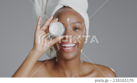 Black woman, portrait and beauty with skincare, cream for face with natural cosmetics on grey background. Lotion, dermatology and African model with smile, moisturizer and treatment in studio Black woman, portrait and beauty with skincare, cream for face with natural cosmetics on grey background. Lotion, dermatology and African model with smile, moisturizer and treatment in studio 138103170