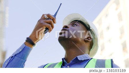 Communication, radio and construction worker, man or manager for project management in urban city. African builder in engineering inspection, building progress or architecture survey on walkie talkie Communication, radio and construction worker, man or manager for project management in urban city. African builder in engineering inspection, building progress or architecture survey on walkie talkie 138103189