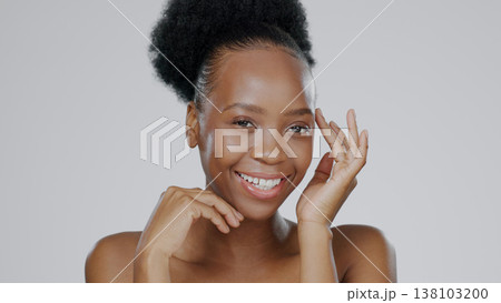 Face, skincare and hands of happy black woman in studio isolated on a gray background. Portrait, touch and natural beauty cosmetics of model in spa facial treatment for wellness, health or aesthetic 138103200