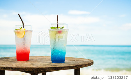 Strawberry daiquiri and Blue hawaii cocktail Drink in Glass on wood Table with View Sea and blue Sky Clear for Tourism Travel Summer Tropical Vacation Relax in Holiday 138103257
