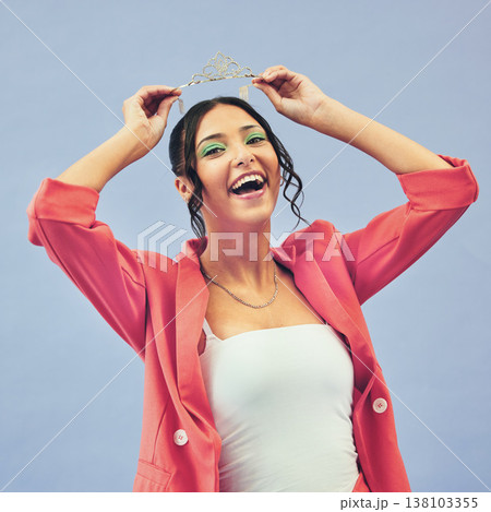 Fashion, beauty and portrait of woman with crown in studio for glamour, luxury and winning prize. Excited, wow and person with tiara for princess pageant, winner and cosmetics on purple background Fashion, beauty and portrait of woman with crown in studio for glamour, luxury and winning prize. Excited, wow and person with tiara for princess pageant, winner and cosmetics on purple background 138103355