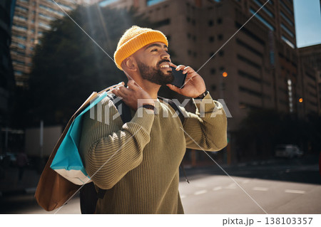 Man, phone call and shopping bag outdoor with travel, walking and talking of deal, discount or retail sale in street. African person thinking of gift choice, package and mobile communication in city 138103357