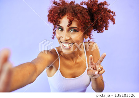 Selfie, smile and woman with peace sign, support and review on a purple studio background. Portrait, person and model with hand gesture, feedback and icon with symbol, happy and post with promotion Selfie, smile and woman with peace sign, support and review on a purple studio background. Portrait, person and model with hand gesture, feedback and icon with symbol, happy and post with promotion 138103526