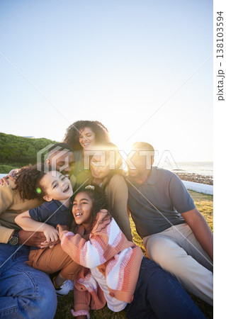 Parents, grandparents and happy children hug outdoor or laughing together on funny vacation in summer. Big family on grass for holiday in nature with care of men, women and kids for sunset sky banner Parents, grandparents and happy children hug outdoor or laughing together on funny vacation in summer. Big family on grass for holiday in nature with care of men, women and kids for sunset sky banner 138103594