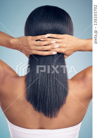 Beauty, hair and hands with a woman from the back in studio on a gray background for shampoo treatment. Keratin, spa or salon for haircare and a model closeup with natural and aesthetic growth Beauty, hair and hands with a woman from the back in studio on a gray background for shampoo treatment. Keratin, spa or salon for haircare and a model closeup with natural and aesthetic growth 138103702