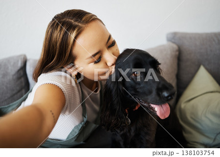 Kiss, selfie and woman with dog on home sofa to relax, love and play with animal. Pet owner, care and influencer person with companion, trust and friendship or social media profile picture and memory 138103754