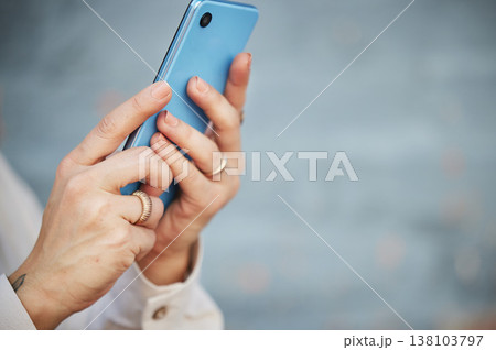 Hands, phone and space with a person closeup on a blurred gray background for social media, communication or networking. Mobile, contact and app with an adult typing or reading a text message Hands, phone and space with a person closeup on a blurred gray background for social media, communication or networking. Mobile, contact and app with an adult typing or reading a text message 138103797
