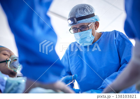Scissors, hospital and surgeon team in theatre for emergency, healthcare or medical procedure. Doctors with a patient to start collaboration, surgery and operation with support and scrubs in ICU 138103821