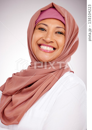 Portrait, skincare and smile with a natural muslim woman in studio on a gray background. Islam, culture or beauty with a happy mature arab person looking confident in her fashion or clothes style 138104223