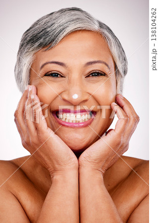 Senior, happy woman and portrait with face cream in skincare or beauty cosmetics against a studio background. Mature female person smile with lotion, creme or moisturizer for spa or facial treatment Senior, happy woman and portrait with face cream in skincare or beauty cosmetics against a studio background. Mature female person smile with lotion, creme or moisturizer for spa or facial treatment 138104262