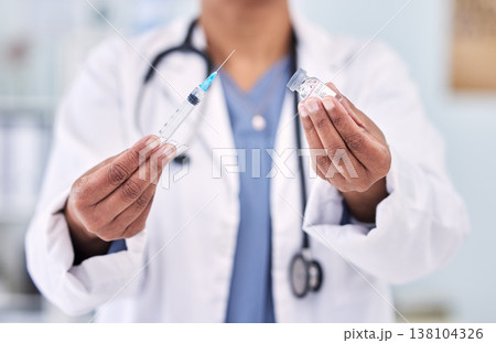 Hands, doctor with needle and vaccine bottle for healthcare, safety from virus and medicine in hospital. Pharmaceutical drugs, person has container and syringe for immunity with health and wellness 138104326