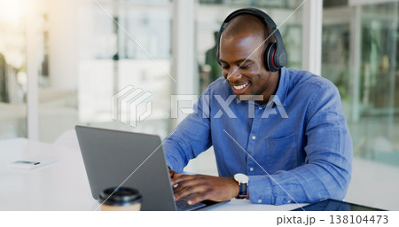 Businessman, laptop and headset by listening to music, podcast or radio for wellness while working. Black person, consultant or employee for typing, report or internet by email for message to client Businessman, laptop and headset by listening to music, podcast or radio for wellness while working. Black person, consultant or employee for typing, report or internet by email for message to client 138104473