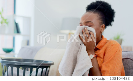 Clean, smell and black woman with laundry in home or basket with clothes, linen or maid spring cleaning in apartment. Fresh, washing and clothing with detergent or cleaner aroma on fabric in house 138104488