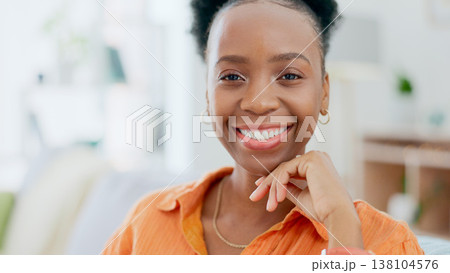 Portrait, freedom and smile with a black woman on a sofa in the living room of her home during the weekend. Face, relax and happy with a confident young person alone in the lounge of her apartment Portrait, freedom and smile with a black woman on a sofa in the living room of her home during the weekend. Face, relax and happy with a confident young person alone in the lounge of her apartment 138104576