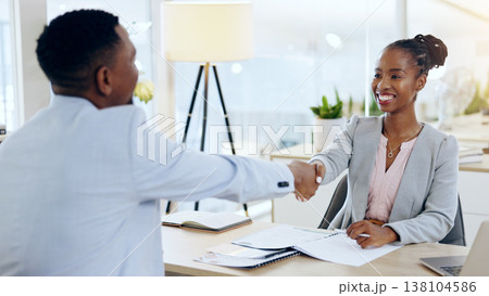 African man, woman and handshake at interview, recruitment and hiring with agreement for job in office. Human resource expert, black business owner or manager with smile, shaking hands and onboarding 138104586