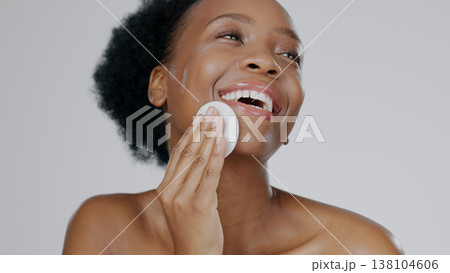 Face, model and hands for beauty with cleanser, cotton sponge and cosmetic in gray background studio. Black woman, healthy skin and dermatology with self care, facial and skincare aesthetic in mockup 138104606