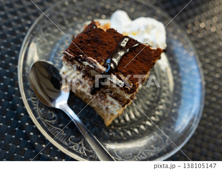 Coffee dessert tiramisu served on saucer Coffee dessert tiramisu served on saucer 138105147