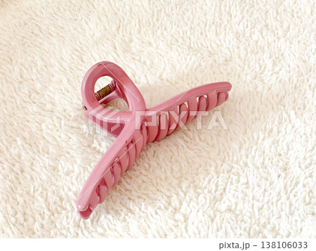 Pink Claw Clip Hair Accessory On White Fur Background Pink Claw Clip Hair Accessory On White Fur Background 138106033