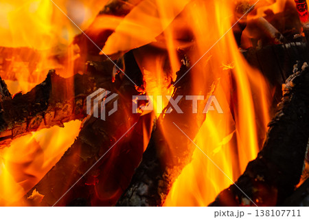 Flame of charcoal fire. Hearth for cooking and heating. Danger in forest 138107711