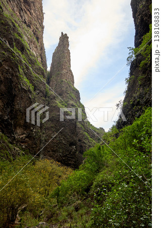 Dramatic Volcanic Canyon with Towering Rock Spire 138108833