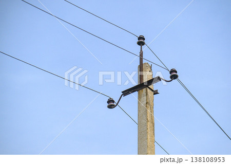 Utility pole with wires under blue sky Utility pole with wires under blue sky 138108953