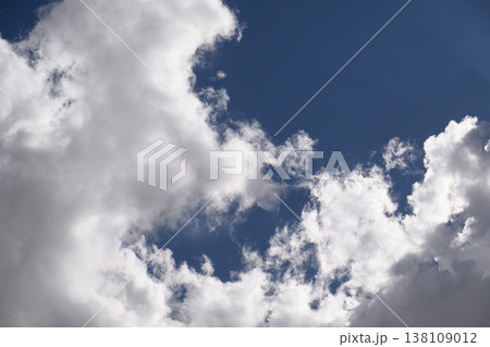 Vast, bright sky filled with soft, voluminous clouds Vast, bright sky filled with soft, voluminous clouds 138109012
