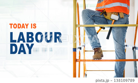Workers celebrate International Workers Day while on scaffolding at a construction site Workers celebrate International Workers Day while on scaffolding at a construction site 138109789