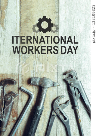 Celebration of International Workers Day on May 1 with tools displayed in foreground 138109825