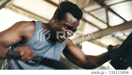 Black man, fitness and cycling at gym in cardio workout, exercise or intense training on machine. African male person on bicycle equipment in sweat or running for muscle, endurance or stamina at club Black man, fitness and cycling at gym in cardio workout, exercise or intense training on machine. African male person on bicycle equipment in sweat or running for muscle, endurance or stamina at club 138113004