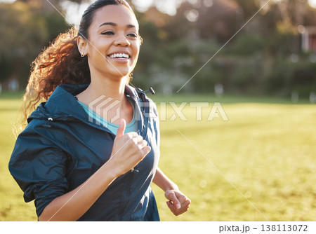 Fitness field, smile and woman running for outdoor exercise, cardio workout or training for park marathon race. Sports warm up, nature freedom or morning runner doing athlete challenge on grass pitch 138113072