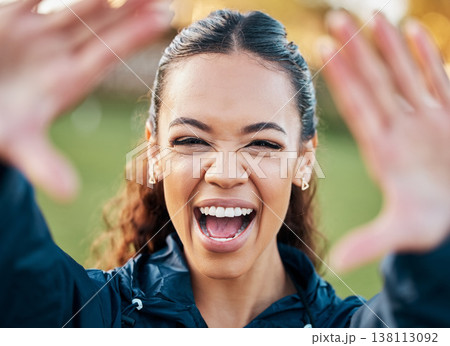 Selfie, face and an excited woman with energy outdoor for freedom or wellness on a blurred background in nature. Portrait, travel and adventure with a happy young person looking positive in summer 138113092
