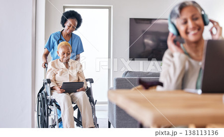 Tablet, wheelchair and assisted living caregiver with a patient in her retirement home for care. Technology, healthcare and black woman nurse helping a senior with a disability for medical support 138113136