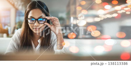 Student, woman and glasses on laptop at cafe for online education, e learning or remote work on banner or bokeh overlay. Young person on computer in vision, reading and online research at coffee shop Student, woman and glasses on laptop at cafe for online education, e learning or remote work on banner or bokeh overlay. Young person on computer in vision, reading and online research at coffee shop 138113386